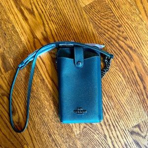 Green coach cross bag. Was a gift-never used.